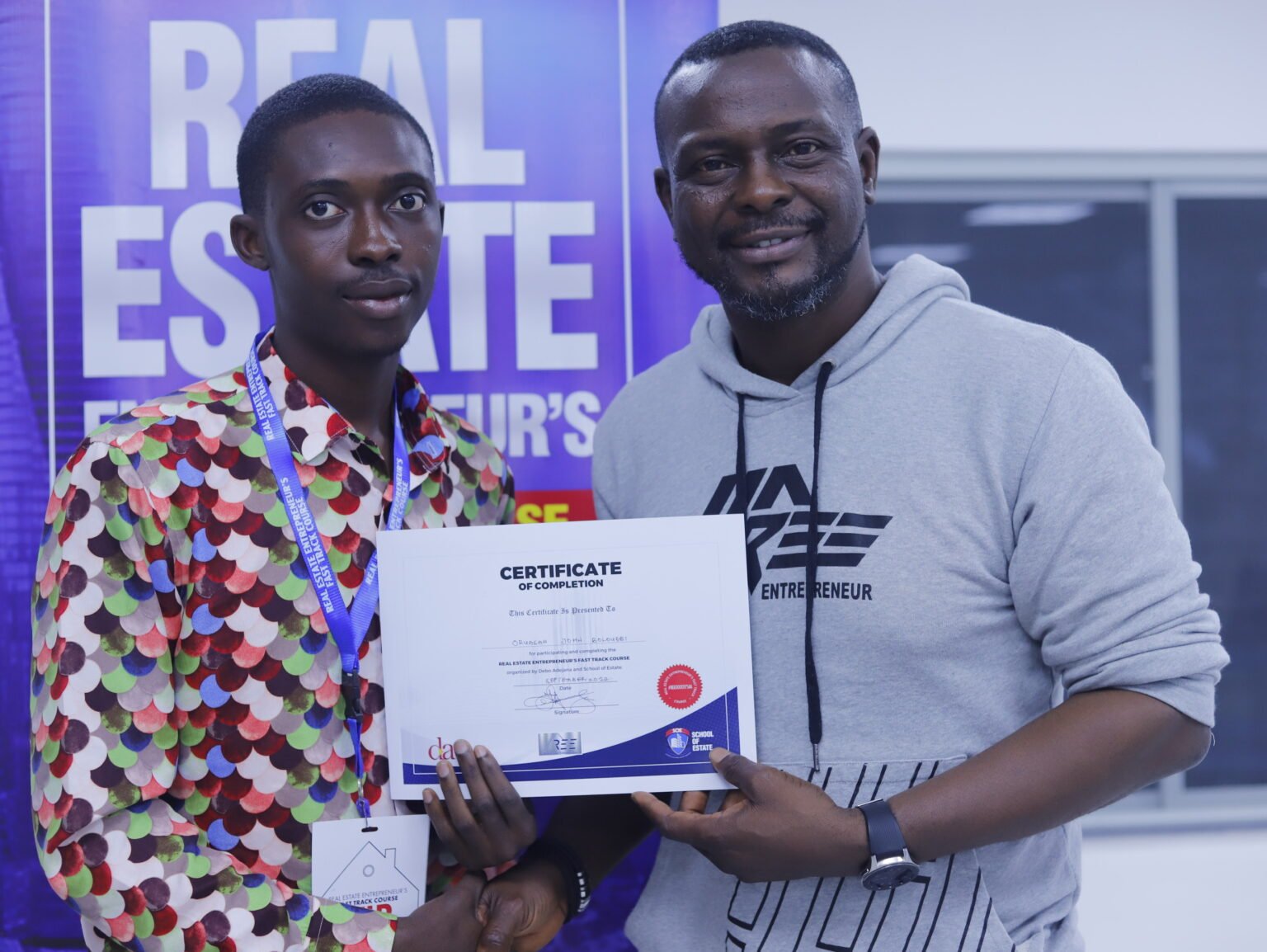 A participant holding his certificate with Engr Debo Adejana